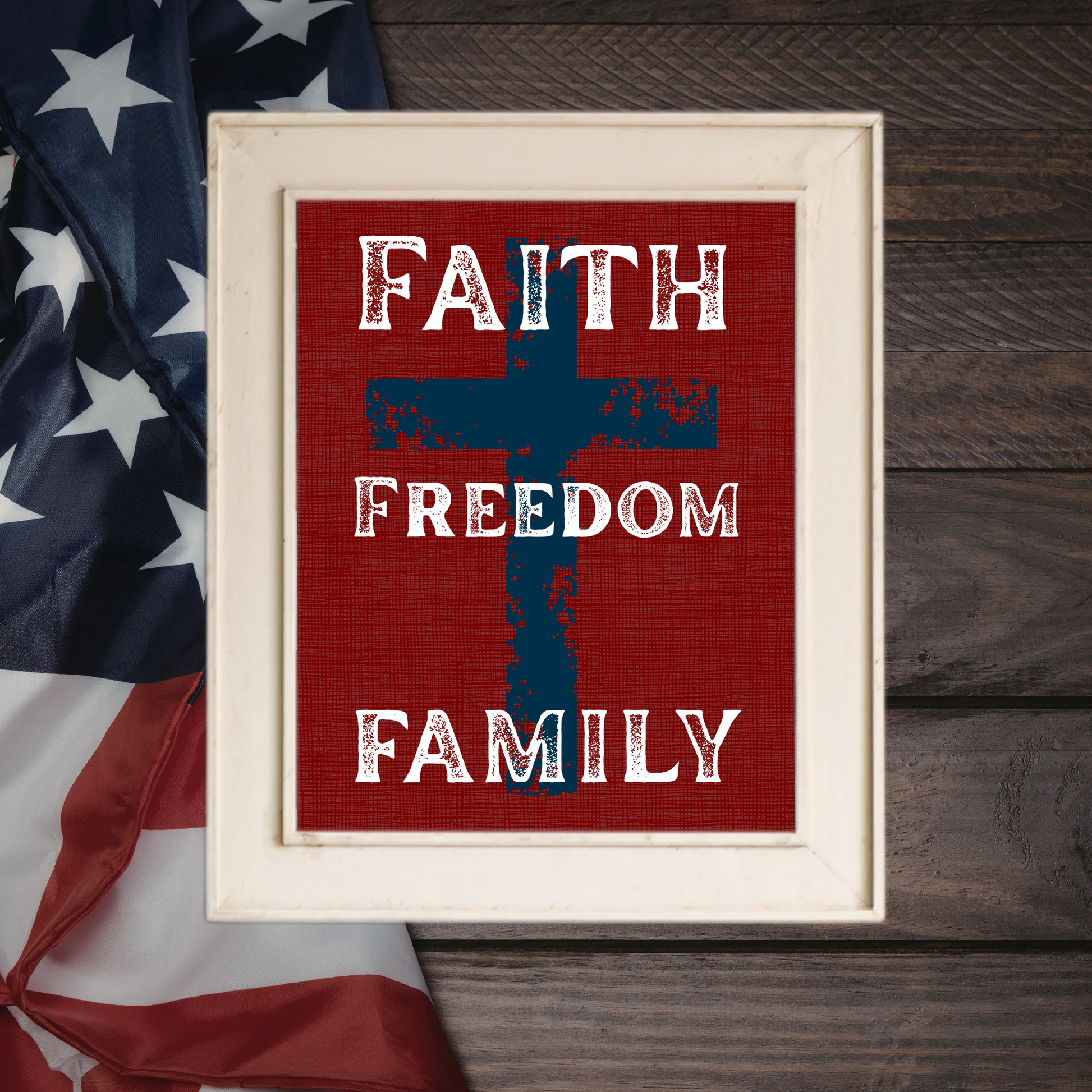 Faith Freedom Family patriotic scripture wall art design featuring a deep brick-red linen background and a subtle cross silhouette.